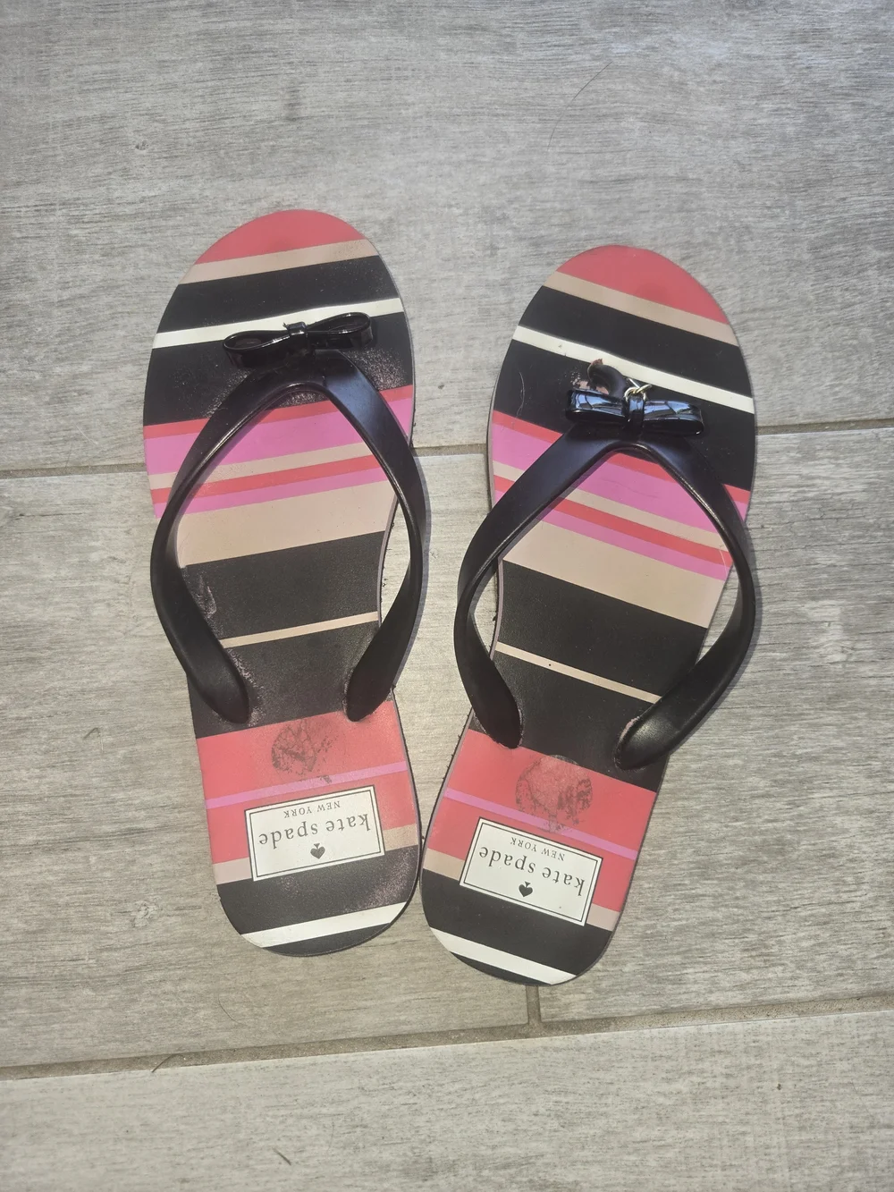 kate spade black-strapped striped bow sandals in pink and tan